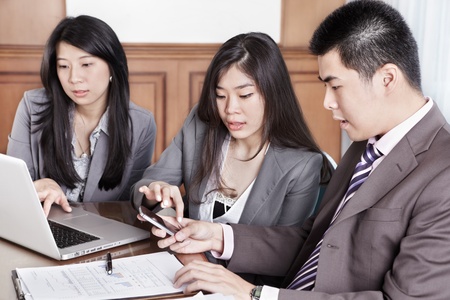 Group of Chinese business people working together in the officeの写真素材