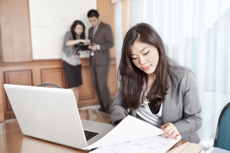 Chinese businesswoman working seriously in the officeの写真素材