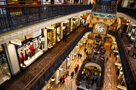 Sydney, Australia - April 18th, 2012 : Indside Queen VIctoria building, where lots of tenants and cafes where visited by lot of people with big iconic hanging clockのeditorial素材