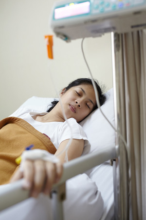 IV frip machine with patient in the hospitalの写真素材