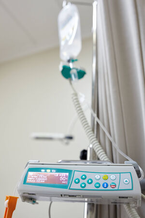 IV drip machine in hospital room powered onの写真素材