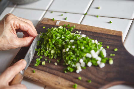 Hand cut scallion used as ingredient for cookingの写真素材
