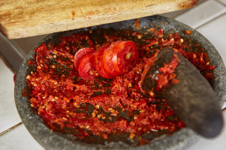 Making sambal, special chilli food in Indonesia to eat together with another meal to add hot and...