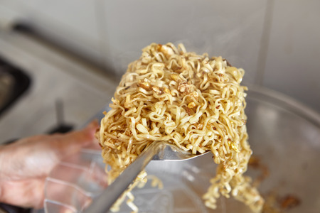 Instant fried noodle with scramble egg ready to be servedの写真素材