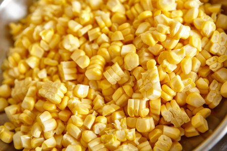 Preparing ingredient by cutting corn to make deep fried ote-ote, traditional indonesia snack