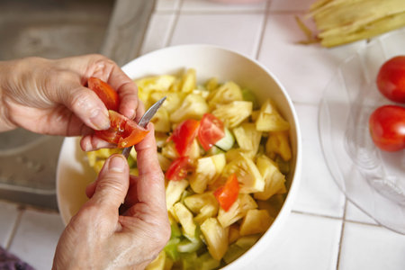 Preparing fresh vegetables for saladの写真素材