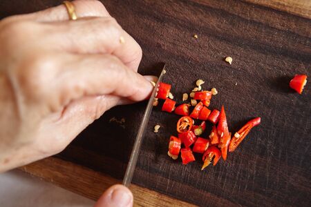 Cut chilli on cutting boardsの写真素材