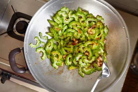 Stir fry the bitter melon on the wokの写真素材