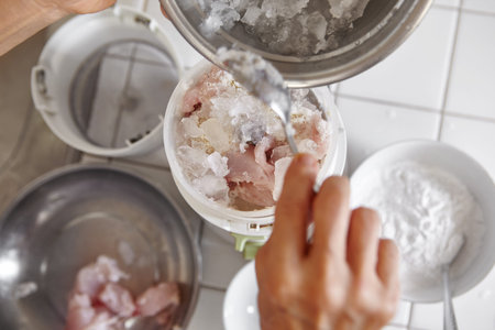 Blending the fish and ingredient using electric blender