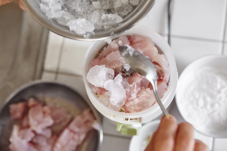 Blending the fish and ingredient using electric blender