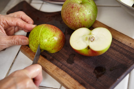 Fresh apple and carrot being prepared to be juiced