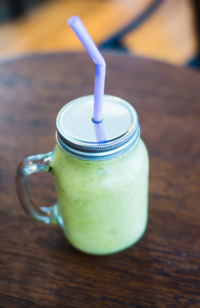 fresh healthy homemade fruit juice  on wooden tableの写真素材