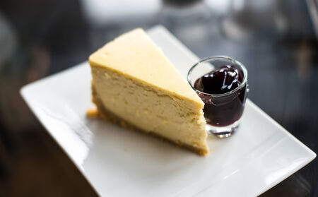 blue berry cheese cake on wooden backgroundの写真素材