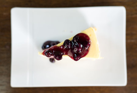 blue berry cheese cake on wooden backgroundの写真素材