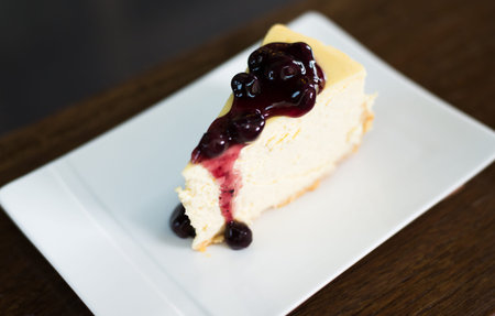 blue berry cheese cake on wooden backgroundの写真素材