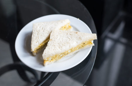 Freshly made clubsandwiches served on glass tableの写真素材