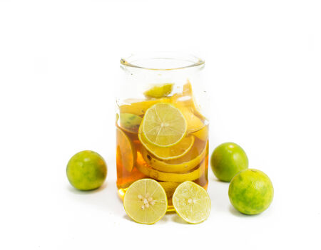 Honey and lemon on a white backgroundの写真素材