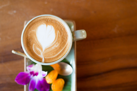 Cup of coffee on a wooden backgroundの写真素材