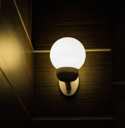 light bulbs on a wooden backgroundの写真素材