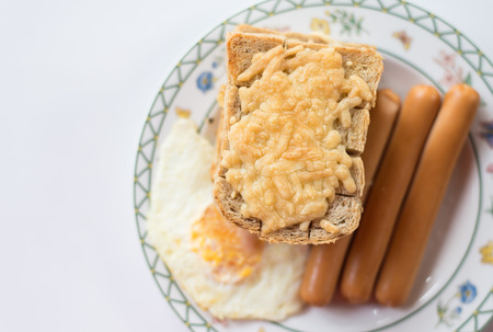 english breakfast with cheeze bread , egg and sausageの写真素材