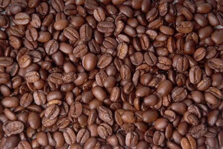 background consisting of aromatic coffee beansの写真素材
