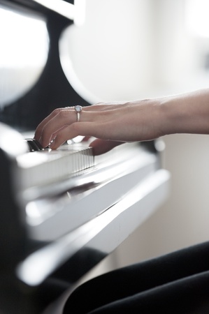 Young girl's hands on piano keyboardの写真素材