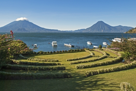 Lake Atitlan in Guatemala with volcanoes Toliman and San Pedro in backgroundの写真素材