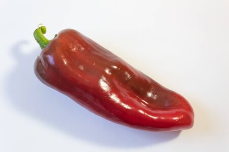 Red Capsicum annuum Cubanelle pepper, Cuban pepper, Italian frying pepper, food ingredient, isolated on white, horizontal aspectの写真素材