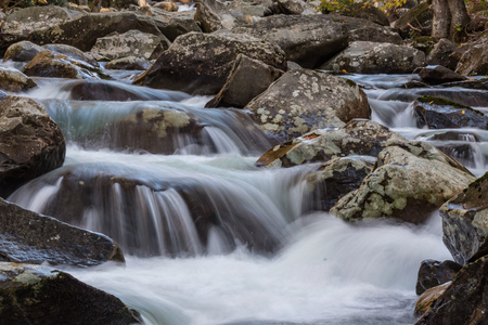 Multiple cascades of water across lichen covered rocks in the Great Smoky Mountains, horizontal aspectの写真素材
