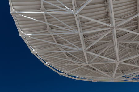 Very Large Array view from bottom of a radio satellite dish at the VLA against a deep blue sky, horizontal aspectの写真素材