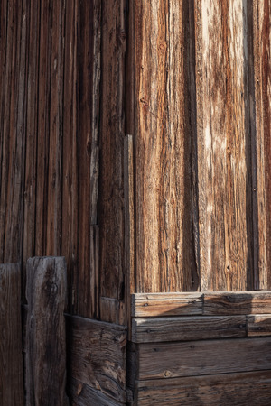 Exterior building corner, board and batten construction details, peeling paint, vertical aspectの写真素材