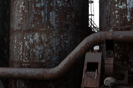 Background of rusting metal industrial shapes and textures, tubes and columns, horizontal aspectの写真素材
