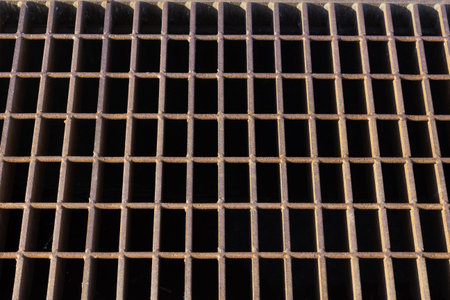 Rusted steel grid grate background pattern, horizontal aspect