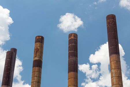 Sloss Furnaces National Historic Landmark, Birmingham Alabama USA, five smoke stacks against a blue sky with clouds, horizontal aspectの写真素材