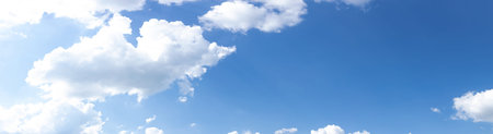 Wide panorama of brilliant blue sky with white clouds, creative copy space, atmosphere and weather,...