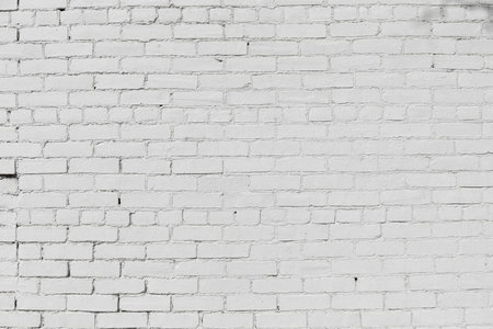 Old brick wall painted white, gaps in the pointing, creative copy space, horizontal aspectの写真素材