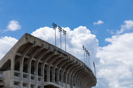 AUBURN ALABAMA, USA - JUNE 18, 2020 - Concrete stadium seating viewed from the outside, blue sky with white cloudsのeditorial素材