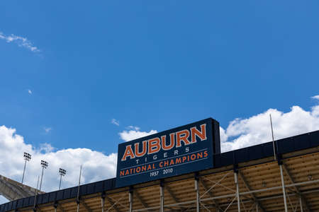 AUBURN ALABAMA, USA - JUNE 18, 2020 - Exterior of the Jordan-Hare Stadium with Auburn Tigers National Champions sign before a vivid blue skyのeditorial素材
