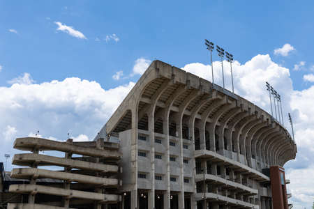 AUBURN ALABAMA, USA - JUNE 18, 2020 - Exterior of the Jordan-Hare Stadium with concrete construction, seating risers and stadium lights before a blue sky with white cloudsのeditorial素材