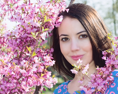 Woman near a flowering treeの写真素材