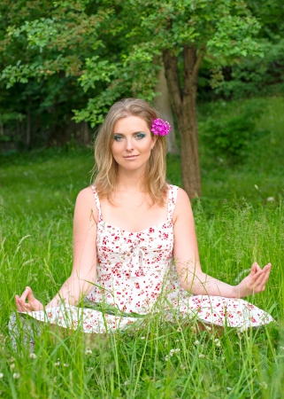 Woman meditating outdoorsの写真素材