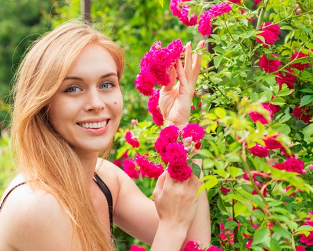 Portrait of a woman with roses の写真素材