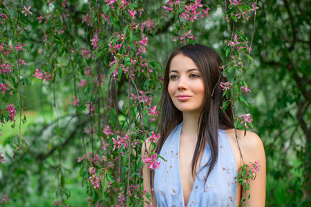  Woman in the flowering branches of a tree