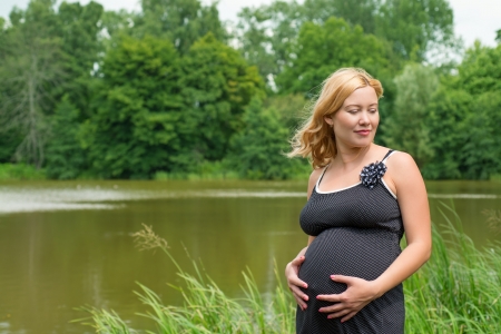 Pregnant woman on natureの写真素材