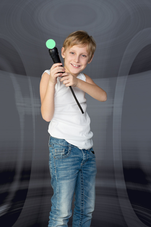 Boy playing a video game controllerの写真素材