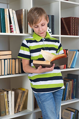 Boy flipping book の写真素材