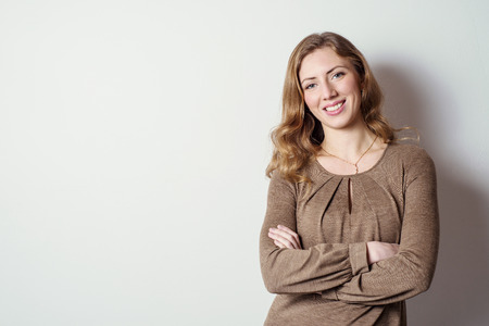 Portrait of a positive young woman with long hair