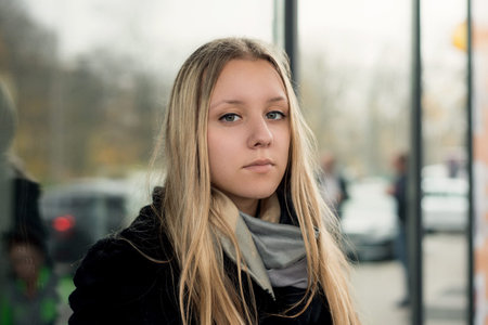 Portrait of a teen girl with long hair in an urban environmentの写真素材