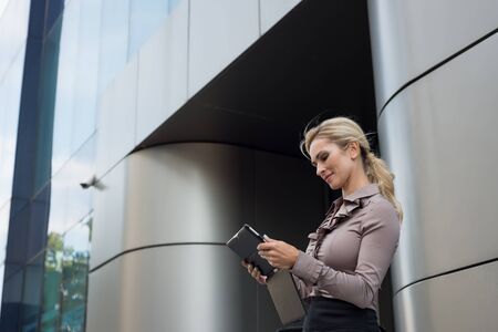 Modern business woman uses a digital tabletの写真素材
