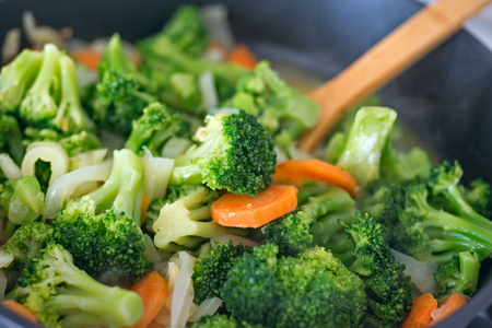 Fresh cabbage broccoli stewed with vegetables in a frying panの写真素材